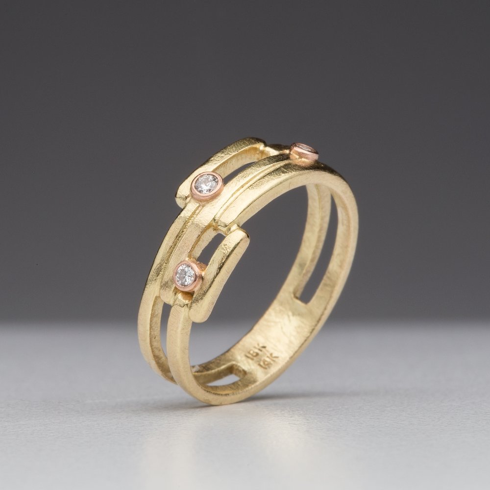 Geometry Perfected: Three-Diamond Yellow Gold Ring